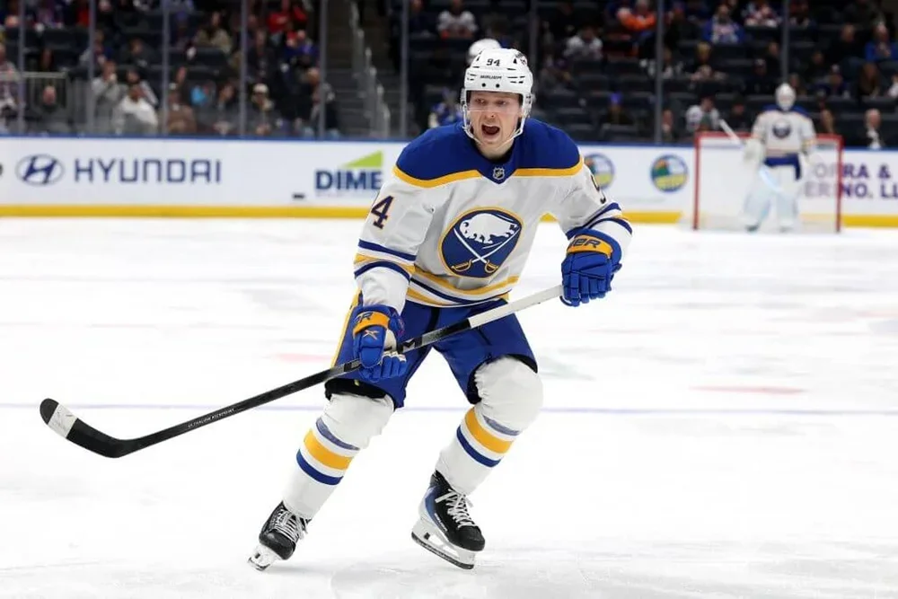 Konsta Helenius barks to a teammate on the ice.